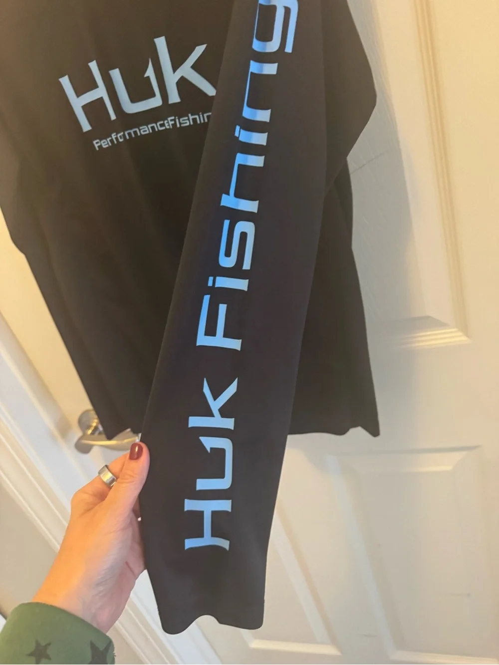 Huk Men's Black Long-Sleeve Performance Rash Guard with Blue Logo